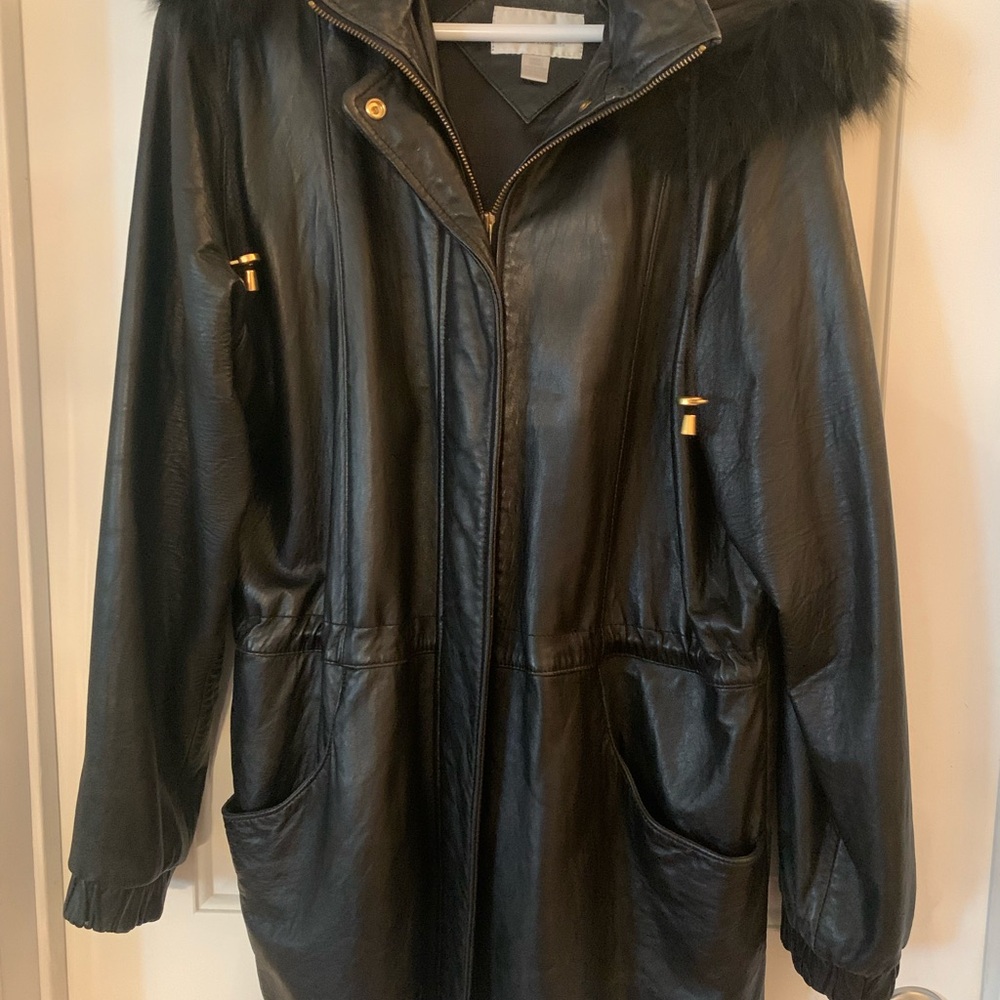 Leather jacket with faux fur trimmed hood